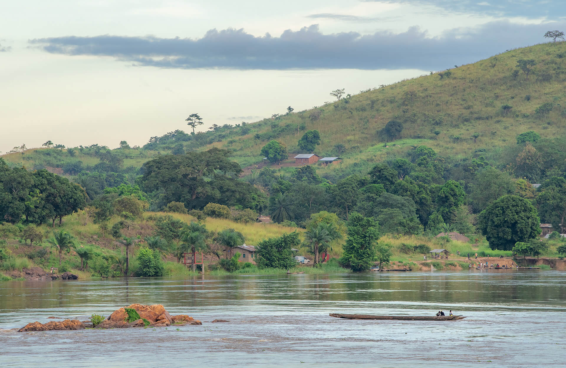 African fisherman rowing a boat on the Ubangi River