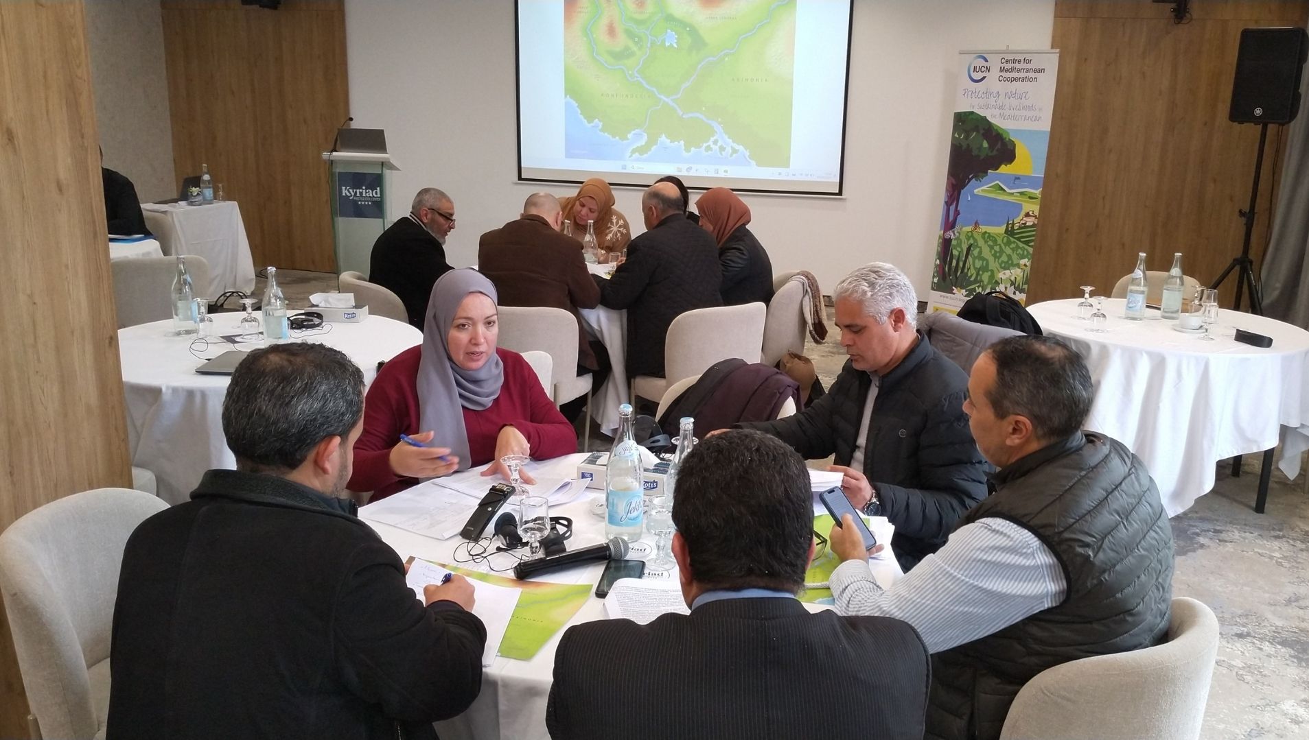 Participants of the Medjerda Basin BRIDGE 5 Dialogues talking around a table